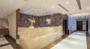 a lobby with a reception desk in a building at Burj Alhayah Alfalah in Riyadh +23 photos