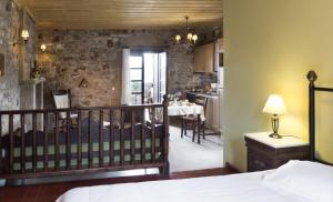 A bed or beds in a room at Klymeni Traditional Homes