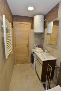 a small kitchen with a sink and a washing machine at Apartments Boka bay in Kotor +80 photos