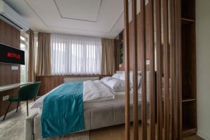 Un pat sau paturi într-o cameră la Lux Apartment Sara - Top Location & Stunning View