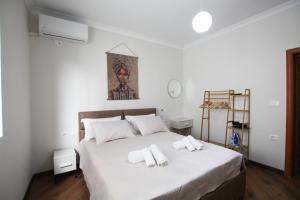 Postel nebo postele na pokoji v ubytování Villa Reve de Tirana