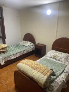 Postel nebo postele na pokoji v ubytování Kouta hotel