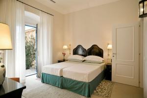 Postel nebo postele na pokoji v ubytování Villa Gallini