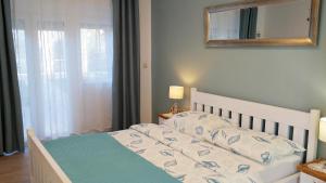Posteľ alebo postele v izbe v ubytovaní Holiday House Holek