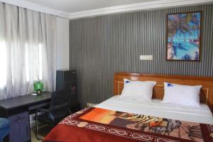 Postel nebo postele na pokoji v ubytování Meka Hotel