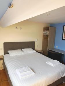 Letto o letti in una camera di Family Hôtel