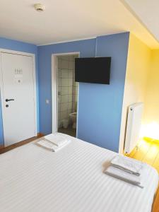 Letto o letti in una camera di Family Hôtel