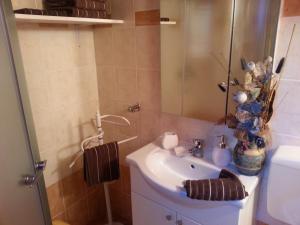 a bathroom with a sink and a mirror at Holiday Home Izabela in Kršan +20 photos