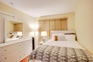 a bedroom with a bed and a dresser and a mirror at Townhome with Pool Access, Near Dtwn Palm Springs! in Palm Springs +17 photos