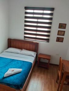 Postel nebo postele na pokoji v ubytování Hotel Café Arábico