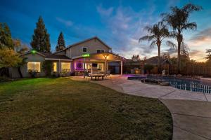 a house with a patio and a pool at Huge House-Yard-Pool Hot Tub in Citrus Heights