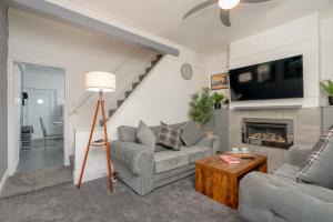 a living room with two couches and a fireplace at Varley View - Colne Sleep 5 in Colne