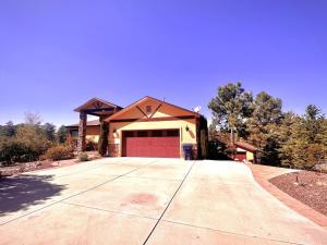 a large house with a red garage at Villa Hermosa- Guest Quarters in Prescott