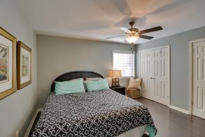 a bedroom with a bed and a ceiling fan at Hot Springs Condo with Lake Access and Community Pool in Hot Springs +23 photos