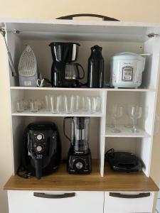 Kaffe- og tefaciliteter på Apartamento Central em Alfenas