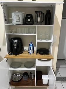 Køkken eller tekøkken på Apartamento Central em Alfenas