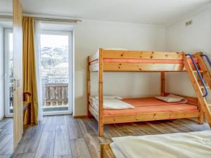 Postel nebo postele na pokoji v ubytování Chalet Staffner