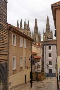 a view of the cathedral from the roofs of buildings at El Refugio de Doña Jimena in Burgos