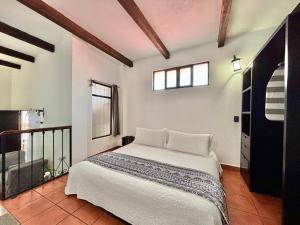 Hotel Boutique Casa Catalá客房内的一张或多张床位