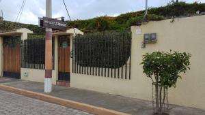 a building with a sign on the side of it at Hotel Rincon Aleman in Riobamba