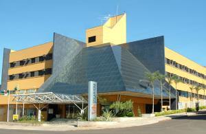 a building with a lot of solar panels on it at Hotel Solarium Express in Cambé