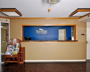 a branch of a bank with a sign on the wall at Baymont by Wyndham Sandusky in Sandusky