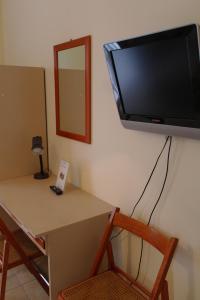TV a/nebo společenská místnost v ubytování Hotel Armando' s