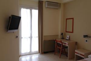 TV a/nebo společenská místnost v ubytování Hotel Armando' s