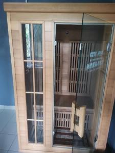 a toy house with a door and a window at Private Sauna, Gym, Studio and SofaBed in Miri