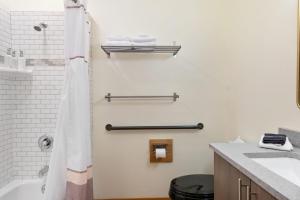 a bathroom with a tub and a sink and a shower at Snowcreek Suite - Aspen - Hot Tub - Kitchenette in Leavenworth