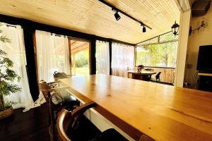a large wooden table in a room with chairs at Levis in Chorazim