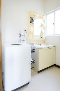 Kuchyň nebo kuchyňský kout v ubytování ROOMzero 5号室