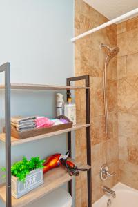 a bathroom with a shower and a toilet and a sink at Master Vacation-Private pool Boutique Design House in Augusta
