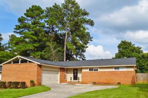 a brick house with a garage at Master Vacation-Private pool Boutique Design House in Augusta