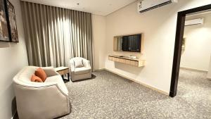 TV o dispositivi per l'intrattenimento presso فندق آرام النسيم
