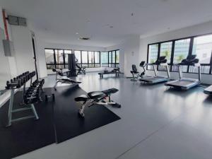 a gym with several exercise bikes and chairs in it at JZ ISoHo i-City Studio 2 beds in Shah Alam