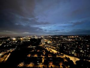 a view of a city at night at JZ ISoHo i-City Studio 2 beds in Shah Alam