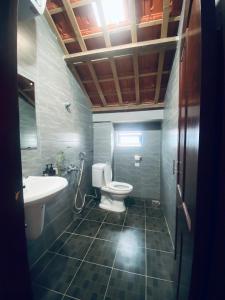 Ванная комната в Cối Xay Gió Homestay Quảng Bình