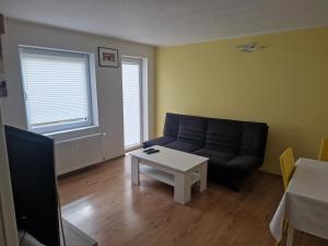 Posezení v ubytování Ferienwohnung am Waldrand