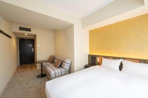 Postel nebo postele na pokoji v ubytování Loisir Hotel Kyoto Toji + 37 fotografií