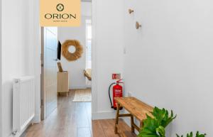 a hallway with a fire hydrant and a wooden bench at The Kepties 3 - Luxurious Serviced Apartment by ORION SHORT STAYS in Arbroath