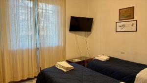 Posteľ alebo postele v izbe v ubytovaní Appartamenti Villa Renata