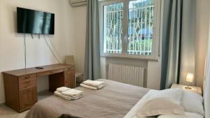 Posteľ alebo postele v izbe v ubytovaní Appartamenti Villa Renata