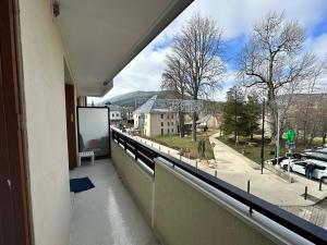 a balcony with a view of a street at Appartement à Villard-de-Lans, 4 pers, 37 m² - FR-1-515-224 in Villard-de-Lans +4 photos
