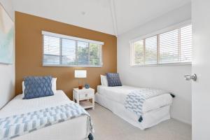 Postel nebo postele na pokoji v ubytování 9 Parkshores - Enjoy an Escape in the Perfect Penthouse Apartment + 17 fotografií