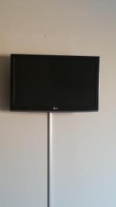 En tv och/eller ett underhållningssystem på Terpsithea Apartments
