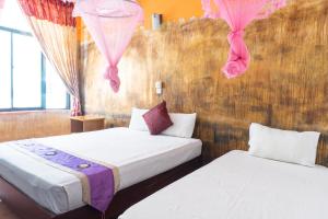 Postel nebo postele na pokoji v ubytování Blumarine Guest House + 64 fotografií