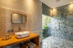 a bathroom with a sink and a shower at Villa Damai Rohani Private Pool Villas with Valley Views Adults Only in Sidemen +35 photos