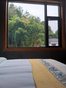 Park One B&B Zhangjiajie Forest Park Scenic Area Shop客房内的一张或多张床位