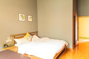 Park One B&B Zhangjiajie Forest Park Scenic Area Shop客房内的一张或多张床位